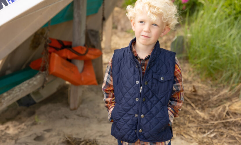 Boy's spring transition outfit in button-down shirt and lightweight vest