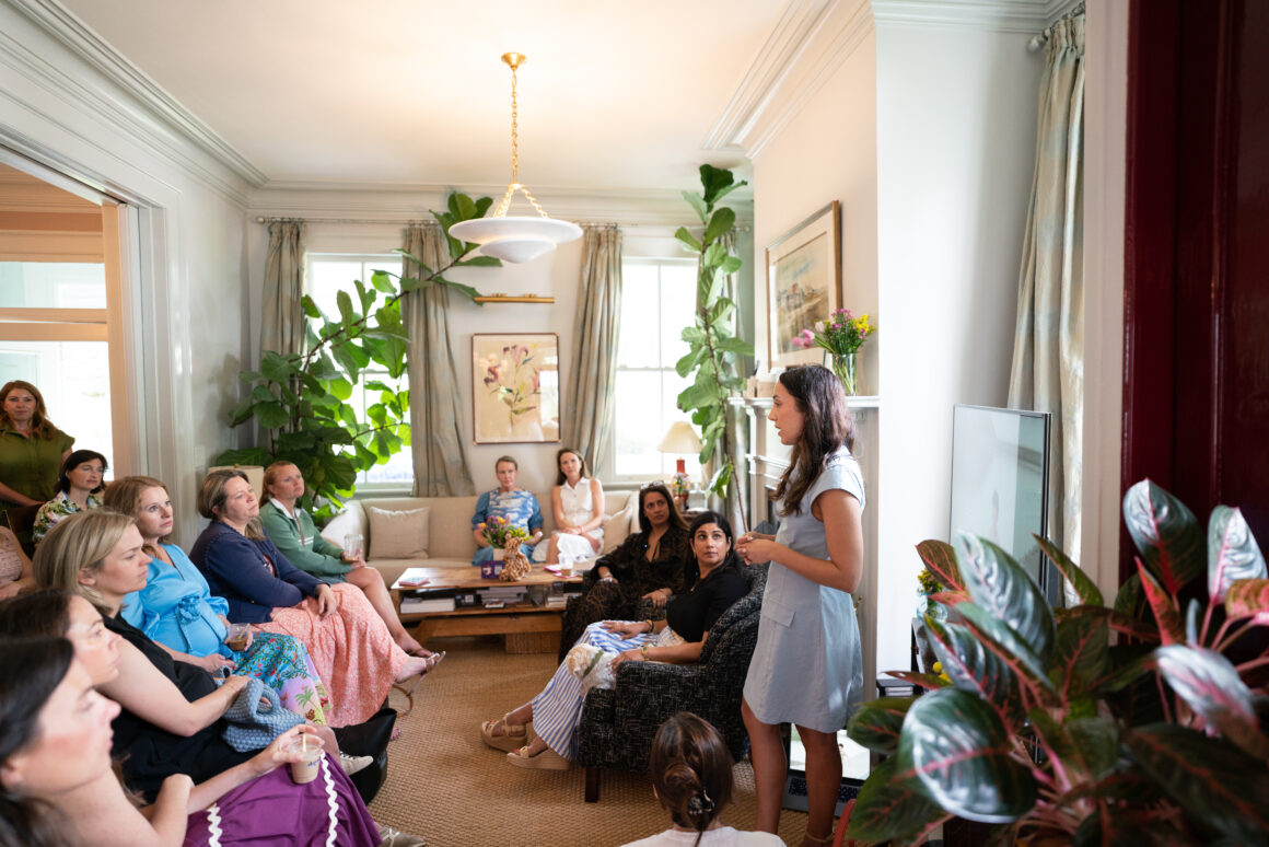 Three women — Anita, Nehal, and Ann Marie — speaking during a women-led event in Charleston, hosted by Pedal Kidswear.
