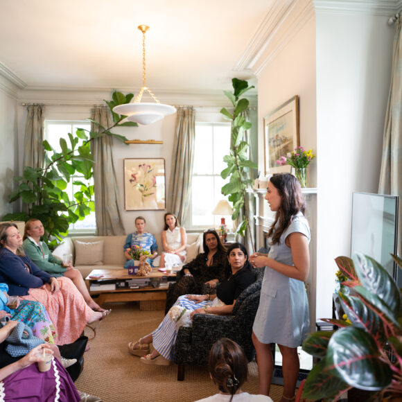 Three women — Anita, Nehal, and Ann Marie — speaking during a women-led event in Charleston, hosted by Pedal Kidswear.